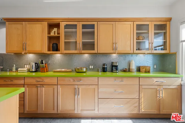 a kitchen with stainless steel appliances granite countertop a sink and cabinets