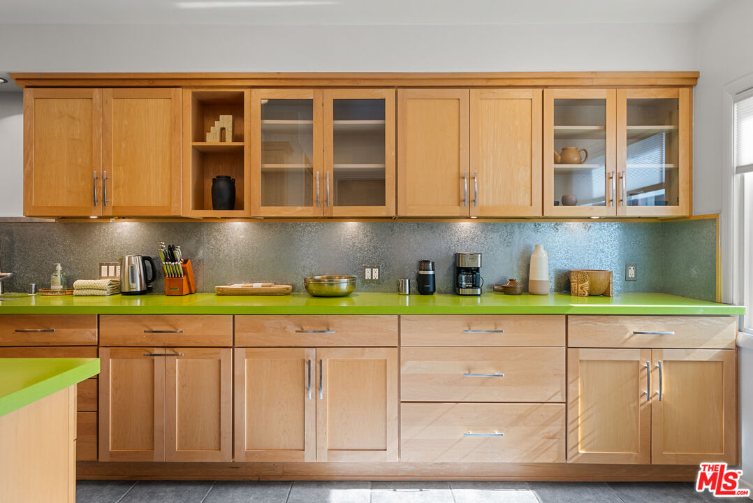 5127 Gaynor Avenue Encino, CA 91436 - Photo 10 of 29 a kitchen with stainless steel appliances granite countertop a sink and cabinets