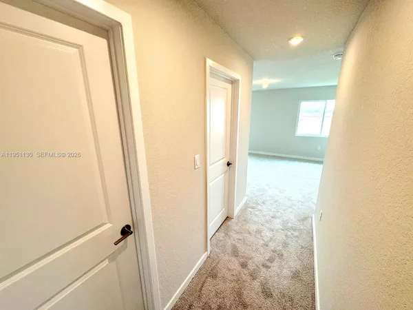 a view of a bathroom with a glass door