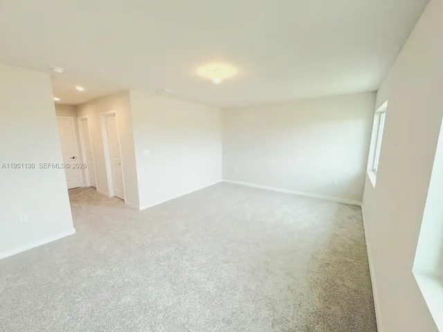 en empty room with windows