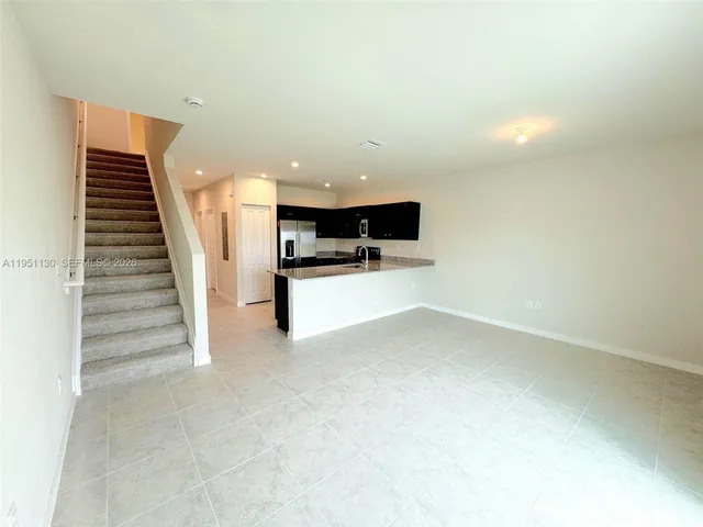 a view of kitchen with microwave and stove