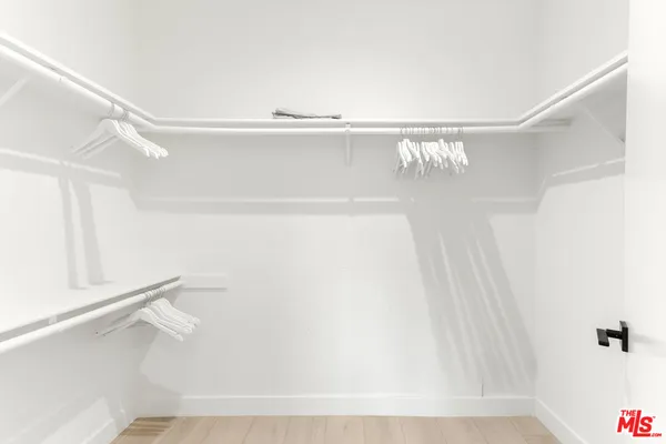 a bathroom with a sink vanity and mirror