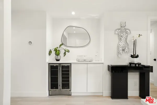 a view of a dining room with furniture wooden floor and chandelier