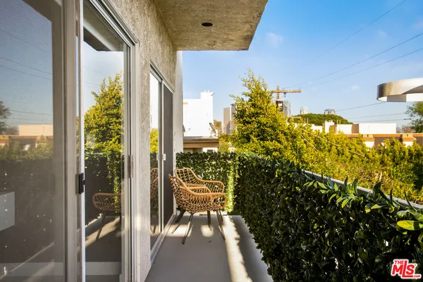 an aerial view of a building with a lot of city