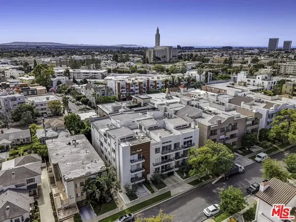 an aerial view of a building with a lot of city