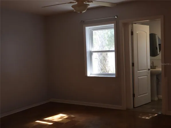 a view of an empty room with a large window