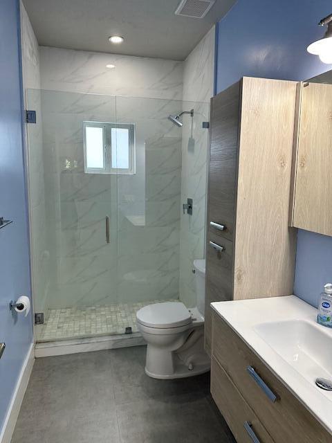 8 Bowen Drive Key Largo, FL 33037 - Photo 13 of 22 a bathroom with a granite countertop sink toilet and shower