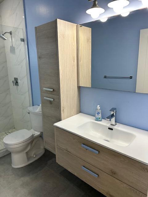 8 Bowen Drive Key Largo, FL 33037 - Photo 14 of 22 a bathroom with a sink toilet and shower