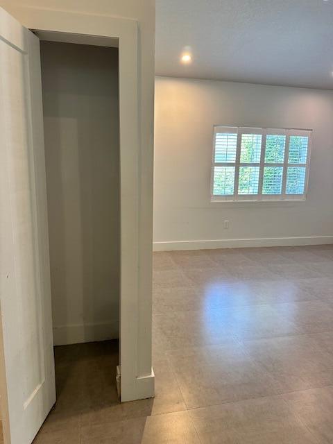 8 Bowen Drive Key Largo, FL 33037 - Photo 10 of 22 an empty room with wooden floor and windows