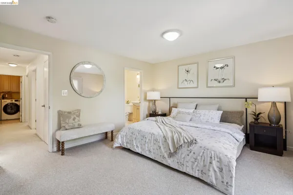 a bathroom with a sink mirror and toilet
