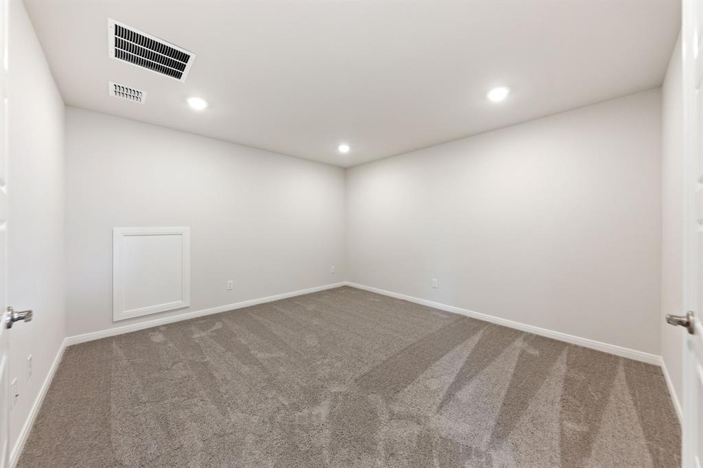 1844 Rosedale Avenue Van Alstyne, TX 75495 - Photo 15 of 26 The spacious media room paired with adjacent game room creates the ultimate family entertainment zone.