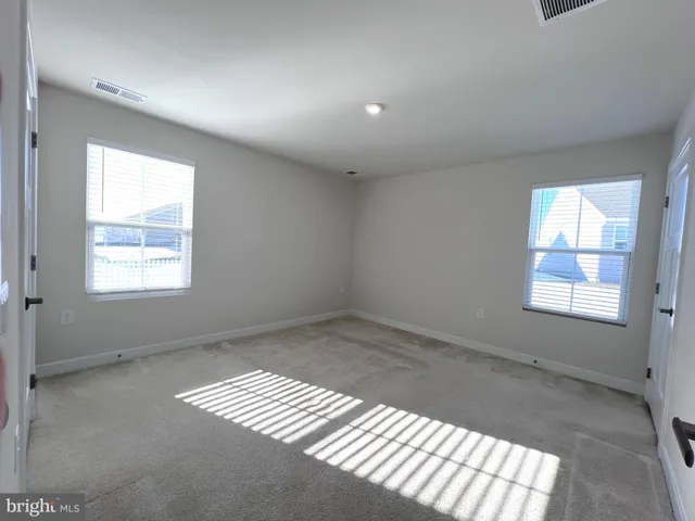 a view of a kitchen from the hallway