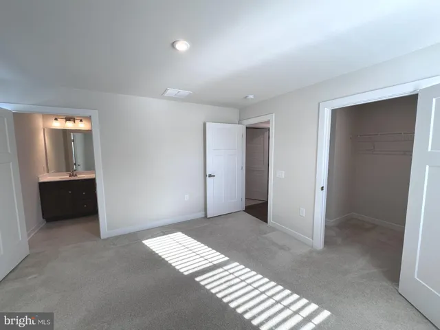 a view of an empty room and a window