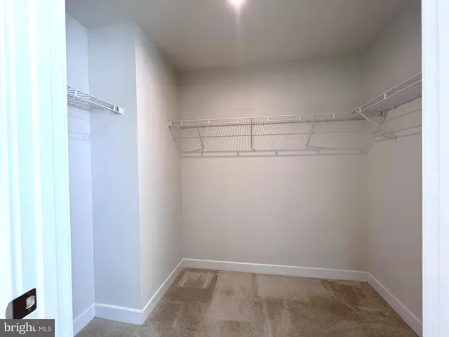 a view of a room with racks on the wall