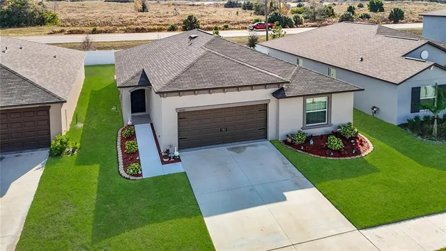 front view of a house with a yard