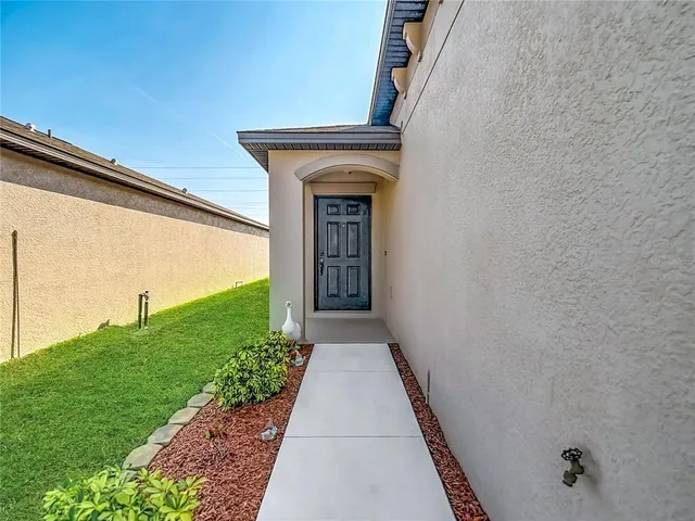 a view of a back yard from a balcony