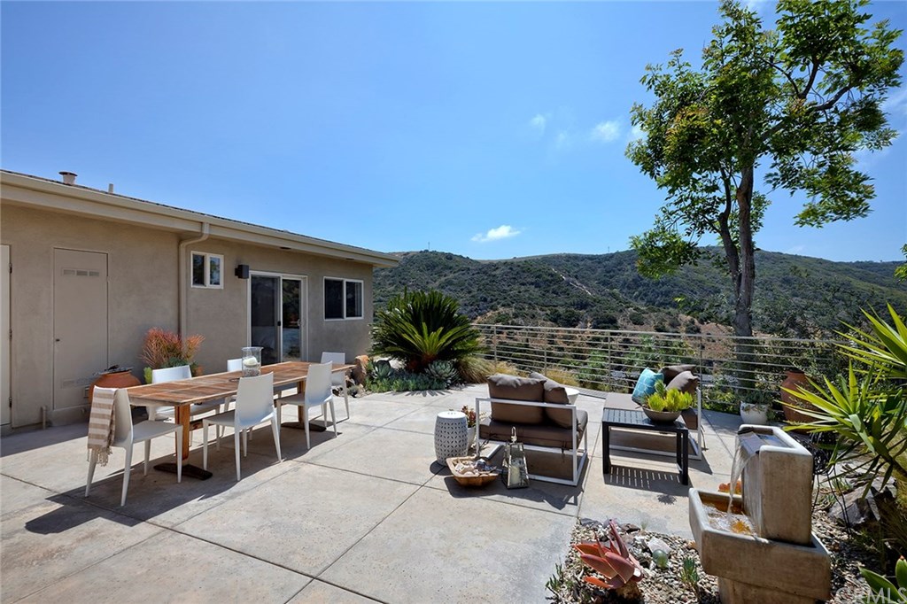 1450 Morningside Drive Laguna Beach, CA 92651 - Photo 15 of 33 Water feature and gorgeous landscaping frame natural hills view