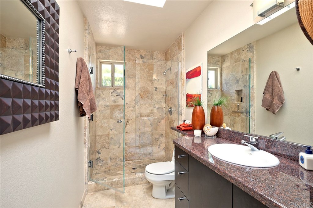 1450 Morningside Drive Laguna Beach, CA 92651 - Photo 29 of 33 Second Bath with Travertine shower and floors and granite counters. This bath also has a generous linen closet.