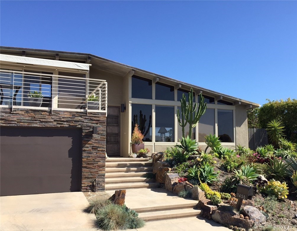 1450 Morningside Drive Laguna Beach, CA 92651 - Photo 30 of 33 Custom Landscaping. Stack stone surround garage door and boulders frame stairs.