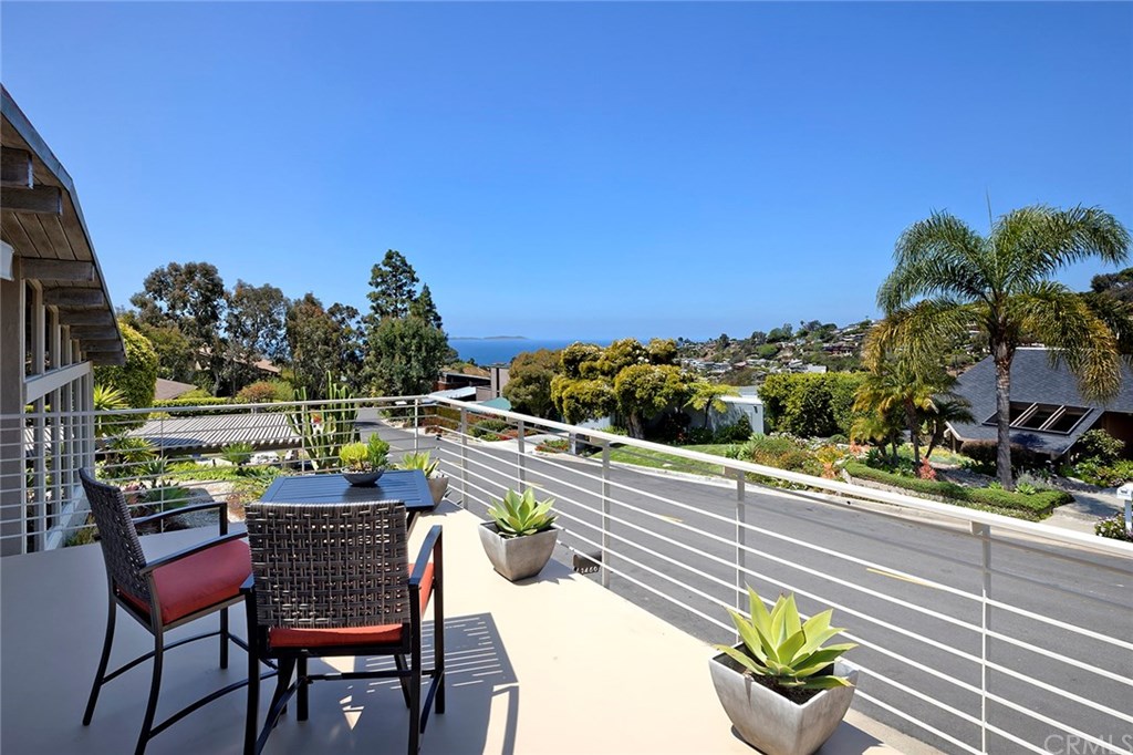1450 Morningside Drive Laguna Beach, CA 92651 - Photo 31 of 33 Front deck with motorized awning and custom metal rails, a perfect place to enjoy morning breakfast or sunset drinks.