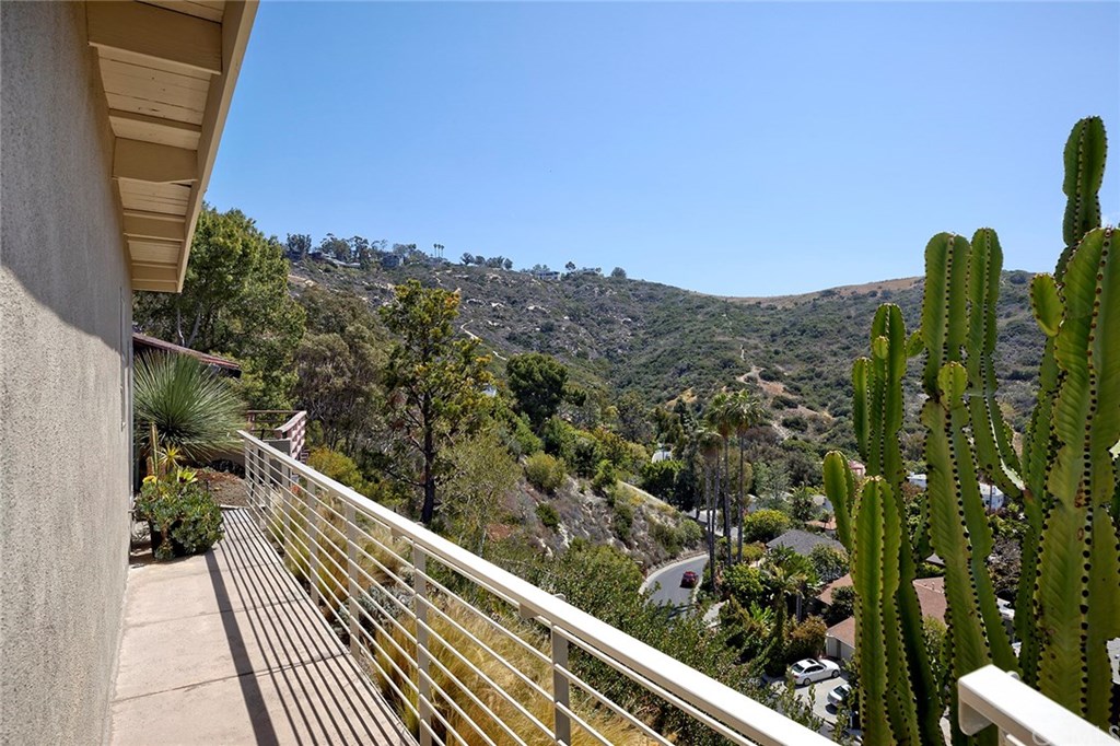 1450 Morningside Drive Laguna Beach, CA 92651 - Photo 32 of 33 Rear Patio continues around back of house with custom metal railing