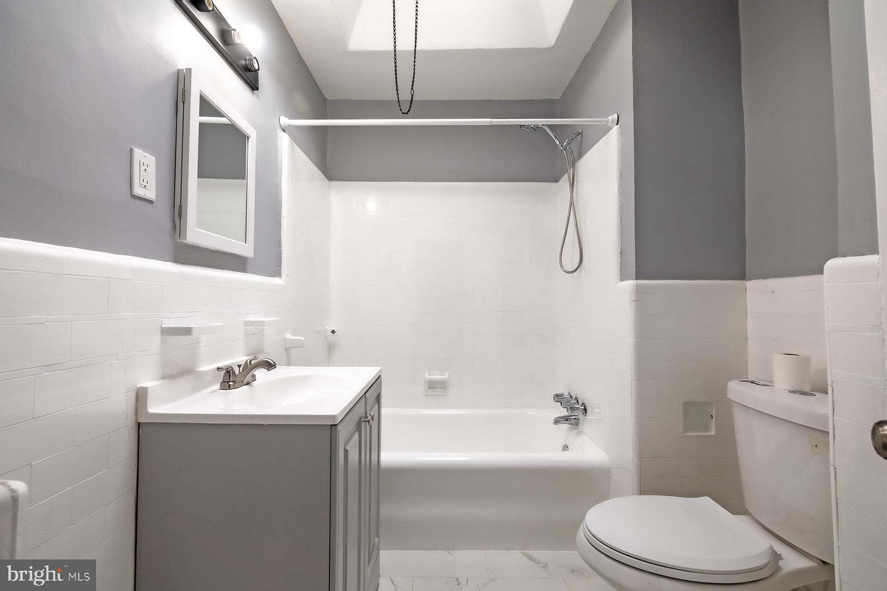 3104 Stirling Street Philadelphia, PA 19149 - Photo 12 of 27 a bathroom with a sink toilet and bathtub
