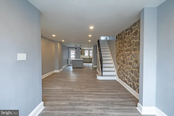 a view of entryway with wooden floor