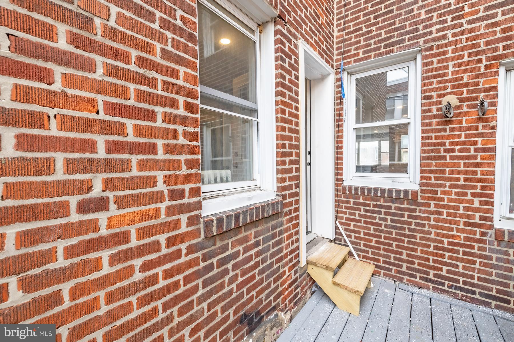 3104 Stirling Street Philadelphia, PA 19149 - Photo 23 of 27 a view of a brick wall with a large window