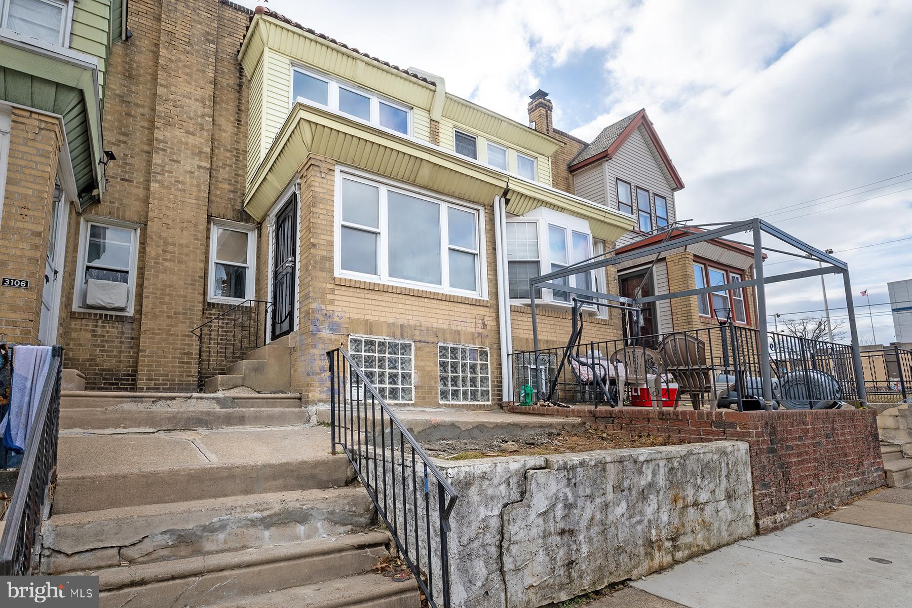 3104 Stirling Street Philadelphia, PA 19149 - Photo 27 of 27 front view of a brick house with large windows
