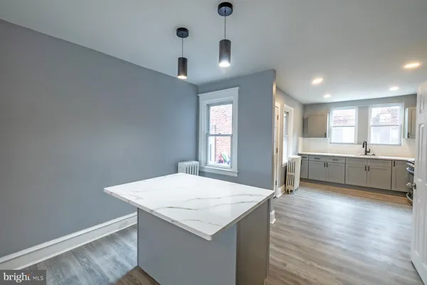 a kitchen with a stove a sink and a refrigerator