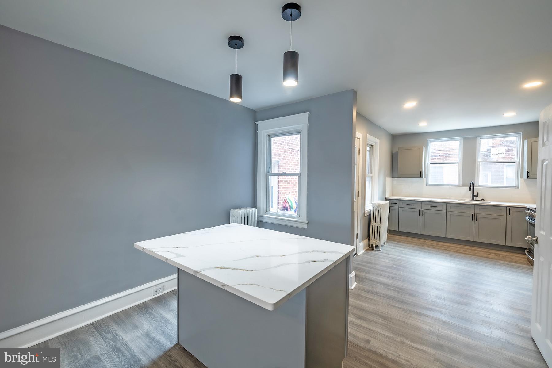 3104 Stirling Street Philadelphia, PA 19149 - Photo 6 of 27 a kitchen with a stove a sink and a refrigerator