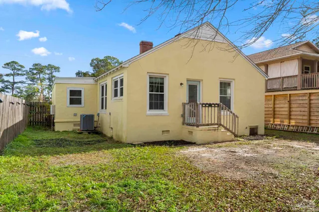 a view of a backyard of the house