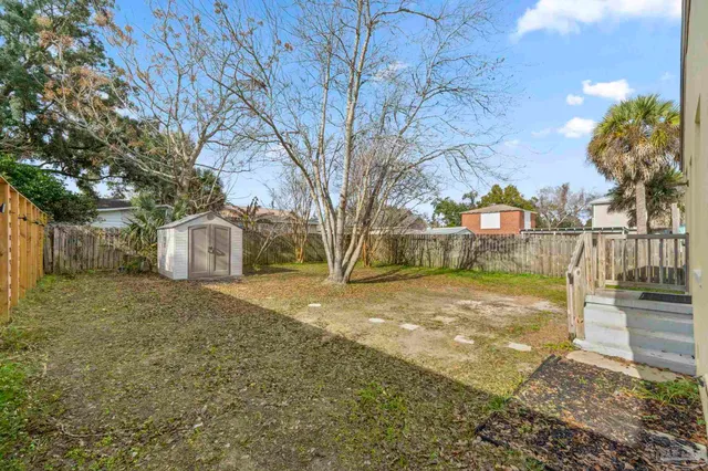 a view of a yard with a house