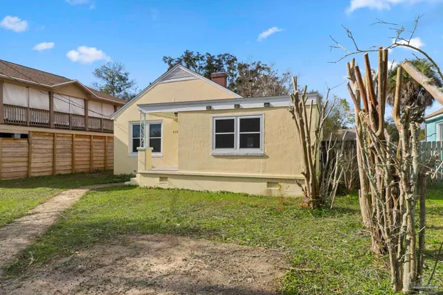 a view of a backyard of the house