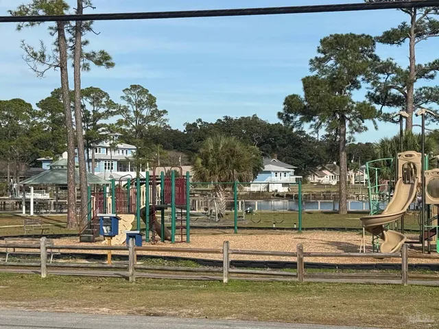 a view of fountain in front of lake