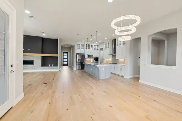 a view of kitchen with furniture and wooden floor
