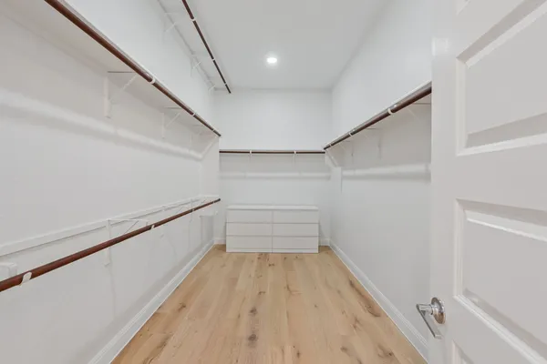 a view of a hallway with stairs