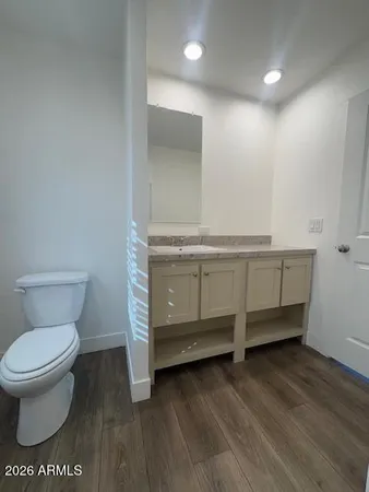 a bathroom with a toilet and a sink