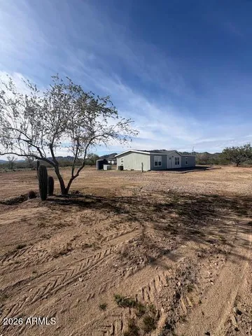 a view of a yard next to a building