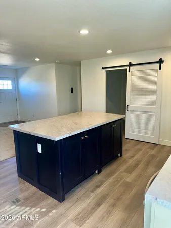 a spacious bathroom with a sink and a mirror