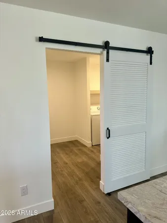 a view of a small space with wooden floor