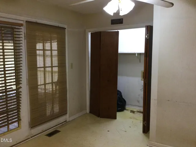 a view of an empty room with a window