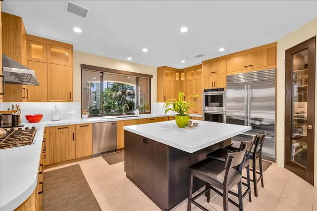 a large bathroom with a large tub sink and double vanity