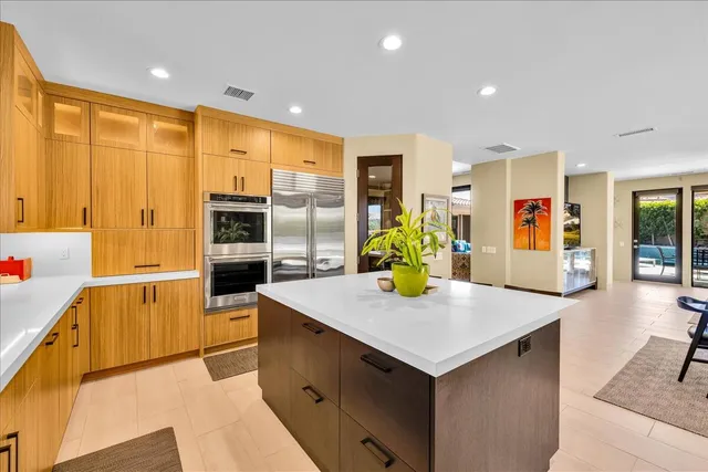 a large bathroom with a large tub and sink
