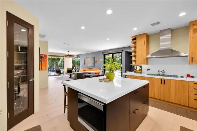 a bathroom with a tub a sink a mirror and shower