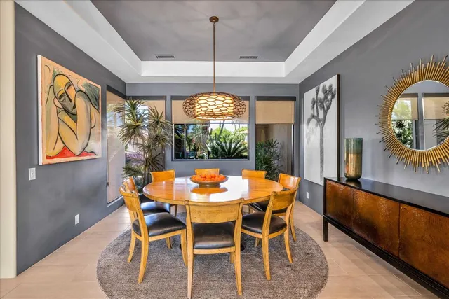 a bathroom with a painting on the wall and shower