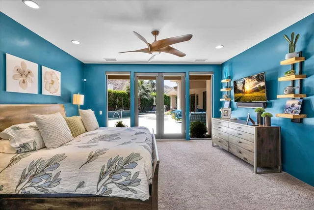 a bedroom with furniture and a window