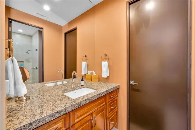a view of a house with pool and chairs