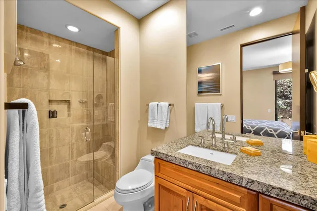 a view of a patio with a table and chairs and potted plants