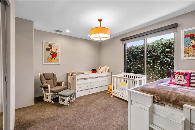 a view of a patio with couches and potted plants
